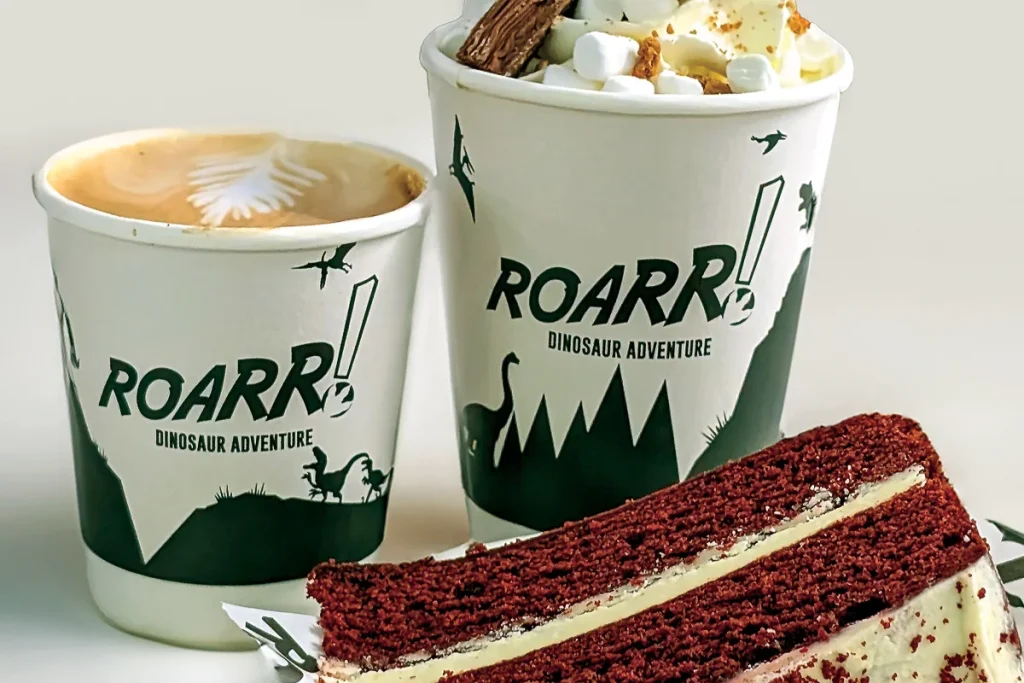 A ROARR! coffee, hot chocolate and a slice of red velvet cake